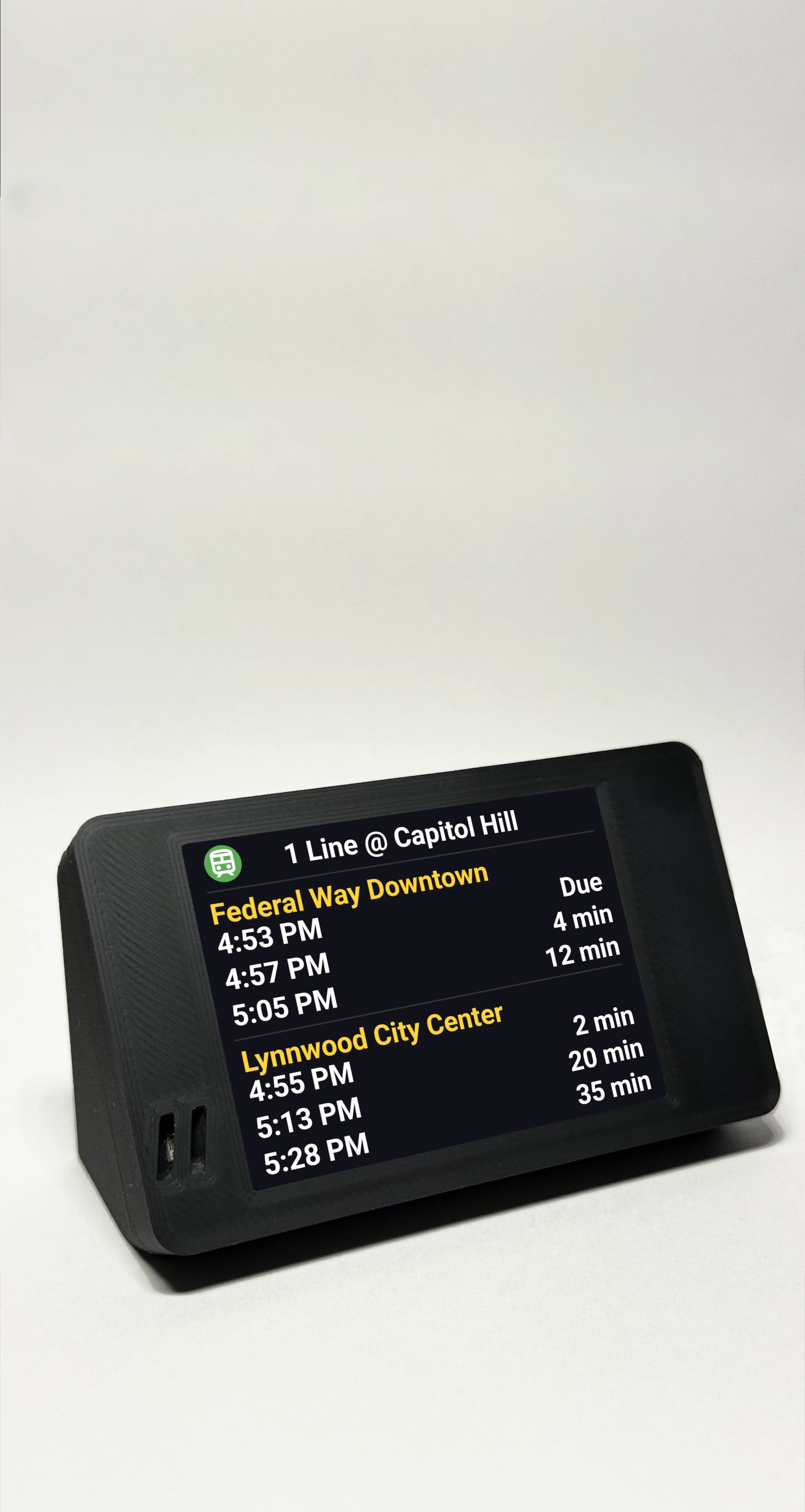 NextStop Mini transit companion displaying real-time bus and train arrival times
